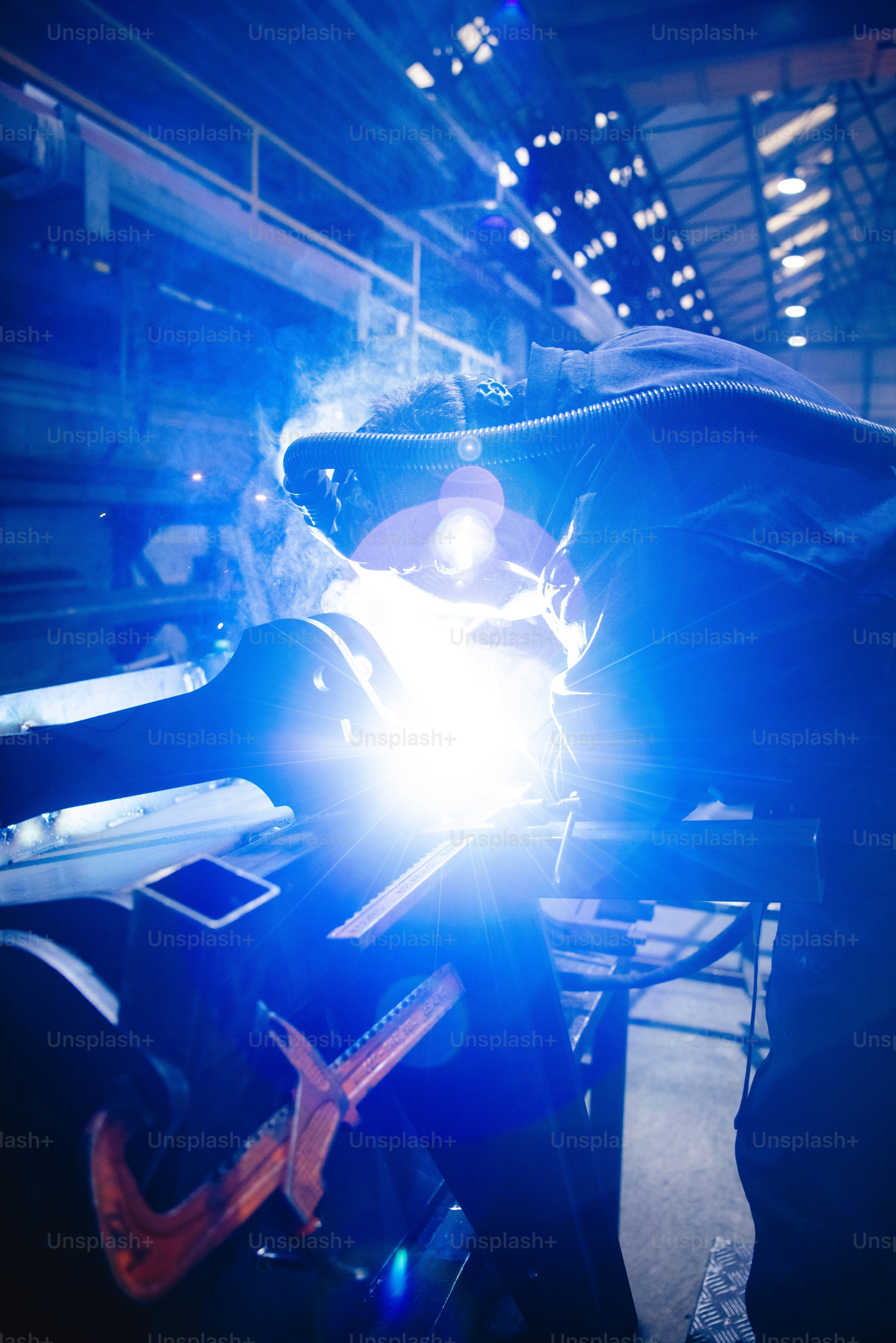 a man working on a motorcycle in a garage