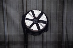 a fan mounted on a wall in a room