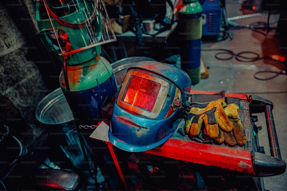 a blue helmet sitting on top of a red table