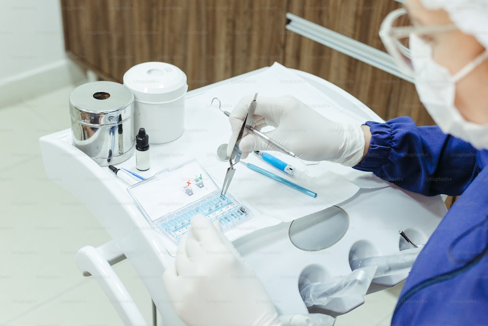 a person in a dentist chair with a pair of scissors