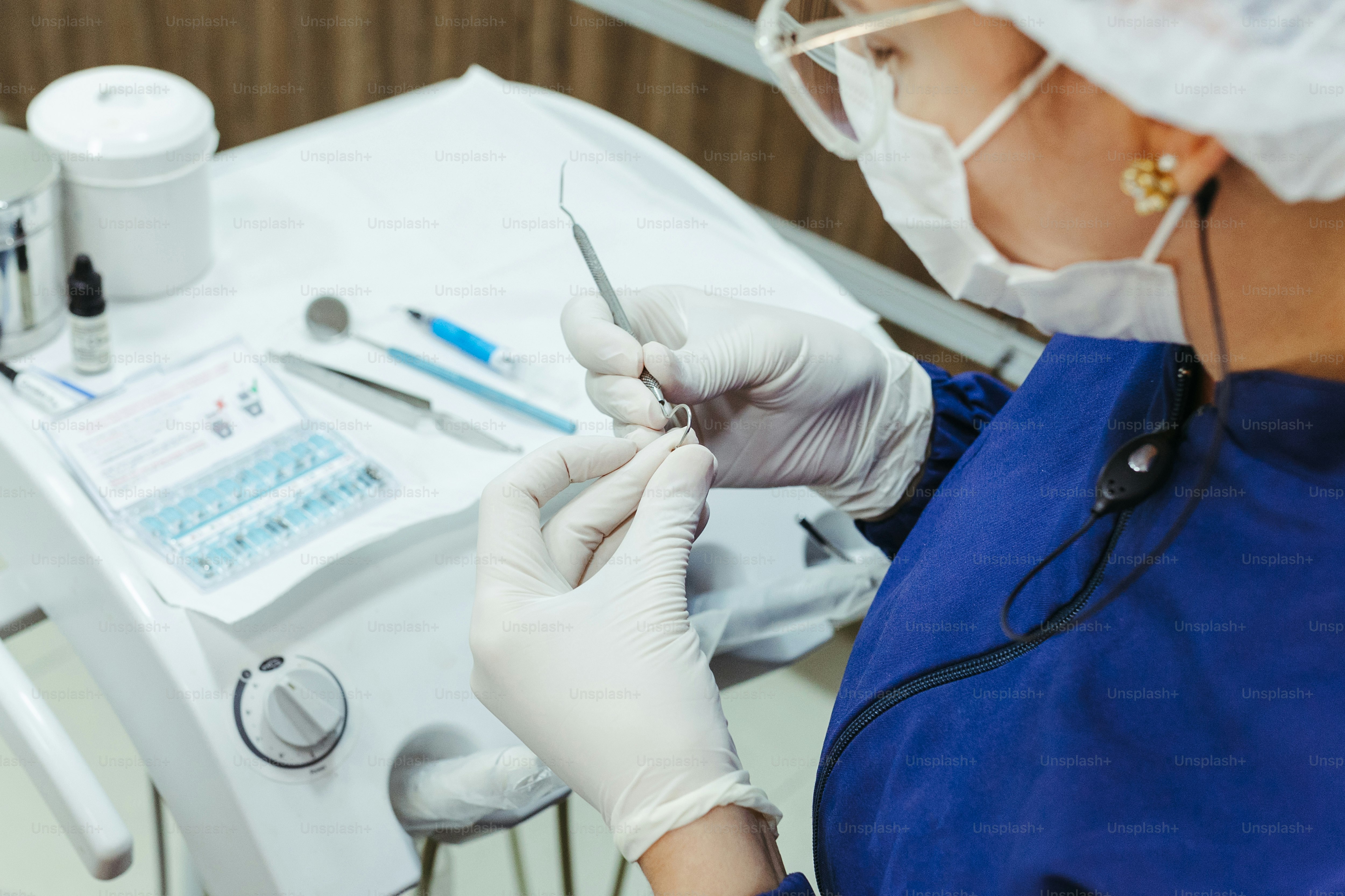 a person in a surgical gown is doing something