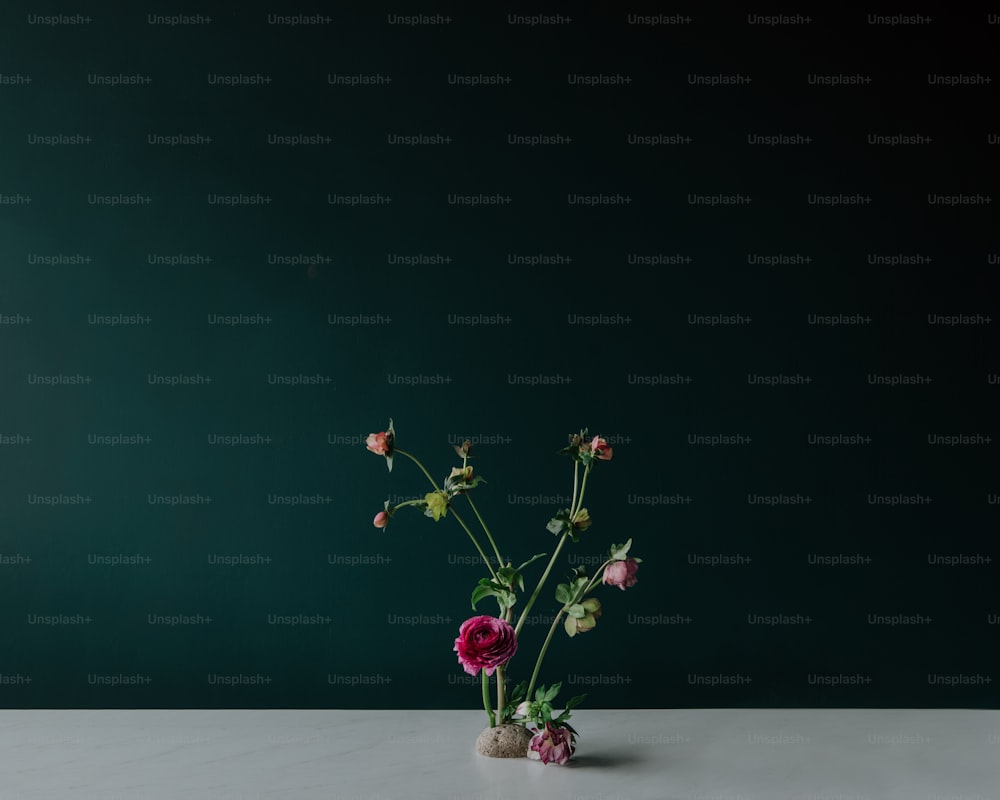 a vase filled with flowers sitting on top of a table