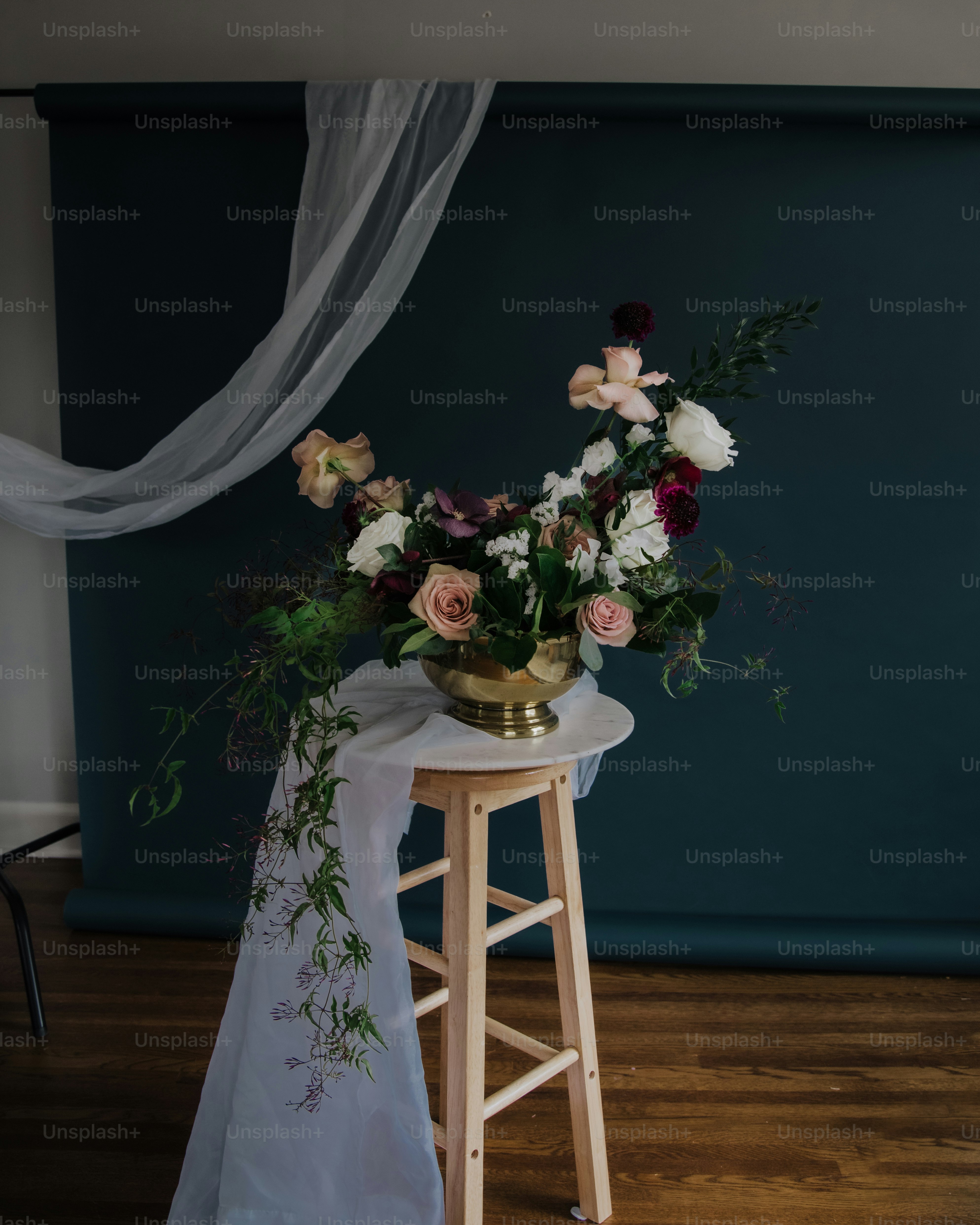 A table with a vase of flowers on top of it photo – Floral Image on ...