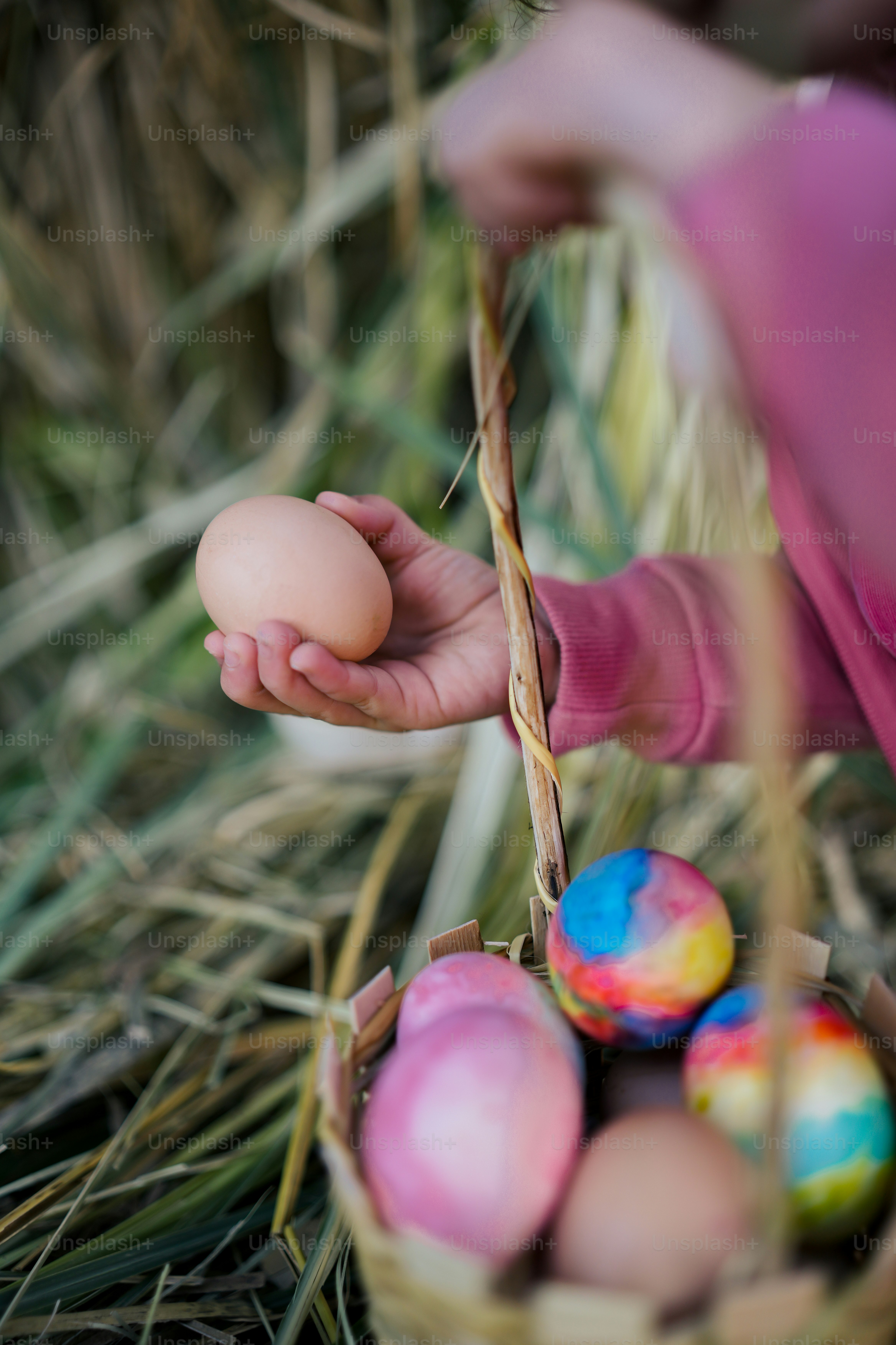 a person holding a basket with eggs in it