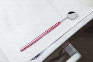 a toothbrush and a mirror on a table