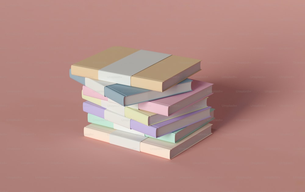 a stack of books sitting on top of a pink surface