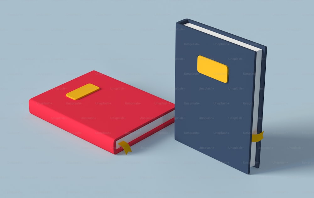 a red and blue book next to a yellow book