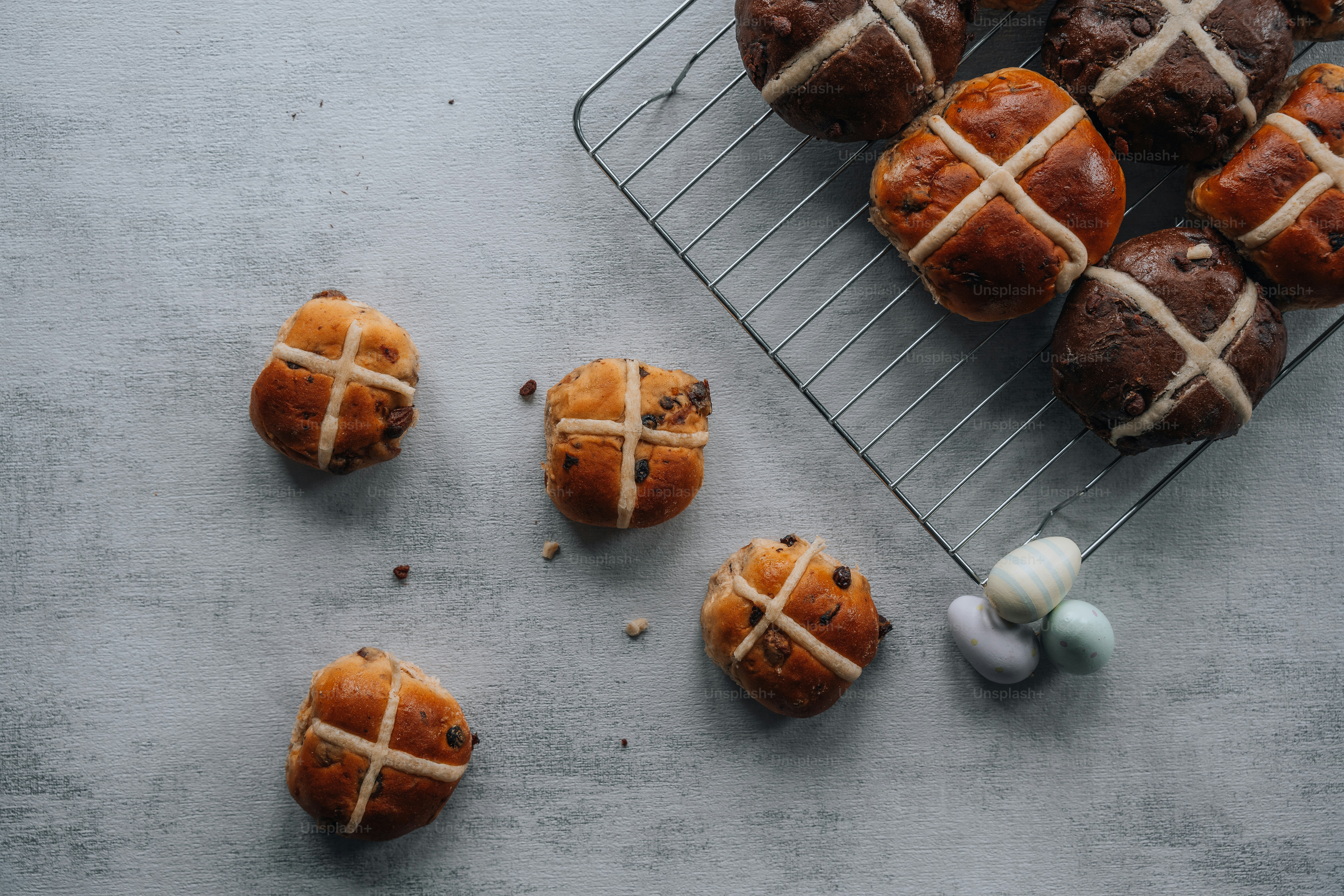 a wire rack filled with pastries next to an egg