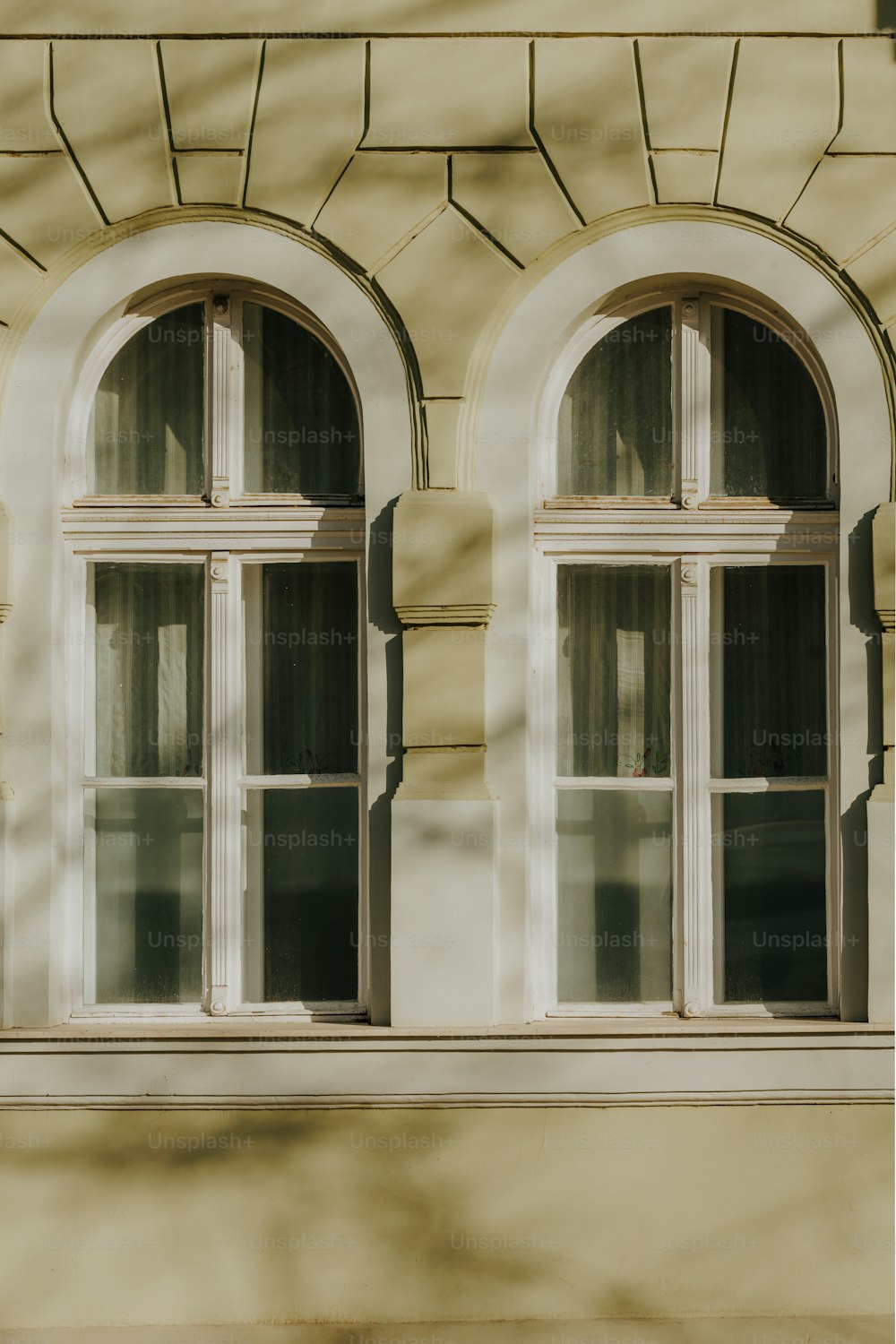 a building with two windows and a clock