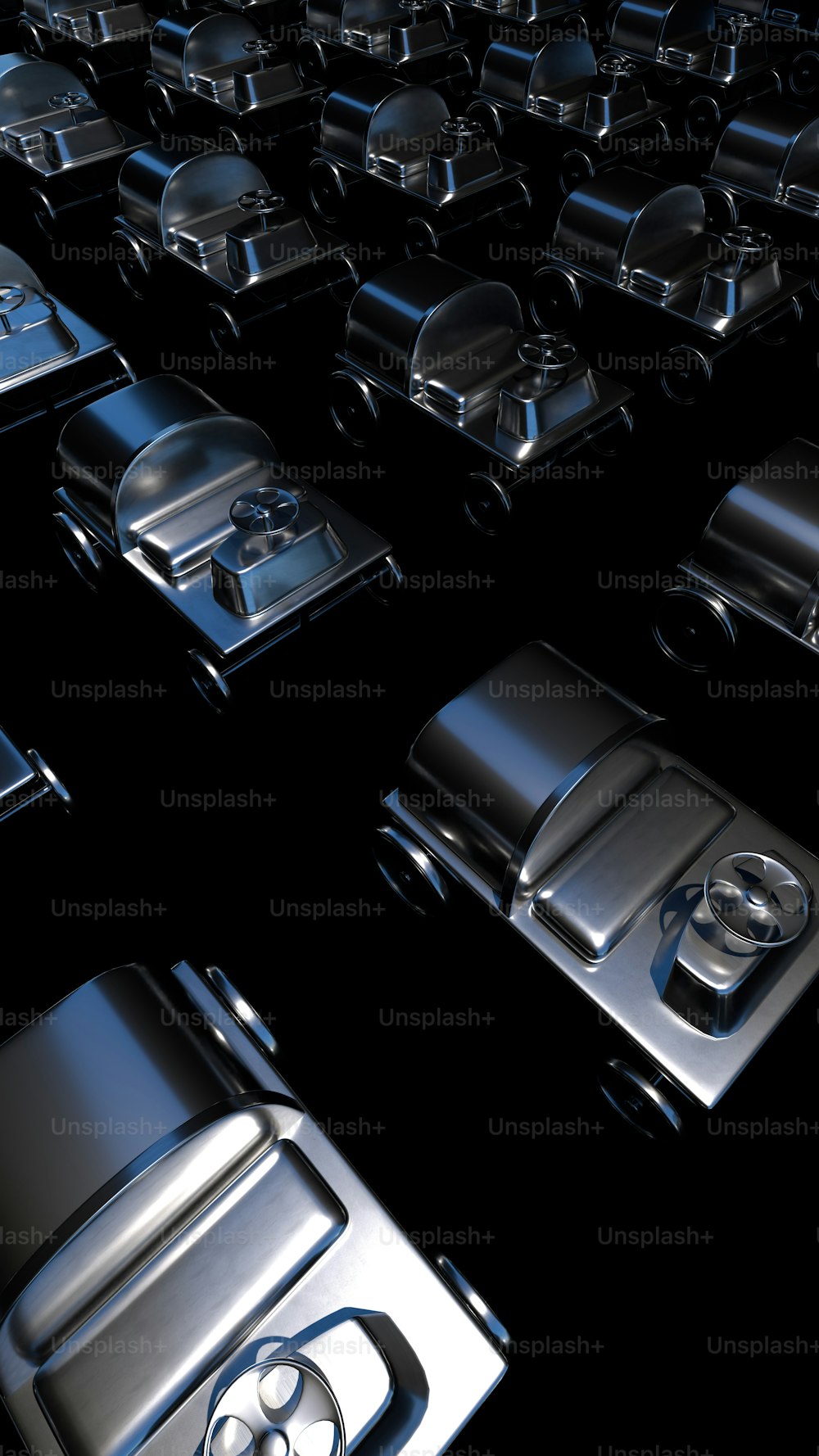 a large group of shiny metal objects on a black background
