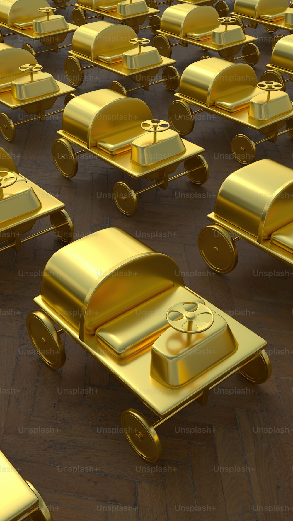 a large group of gold toy cars sitting on top of a wooden floor