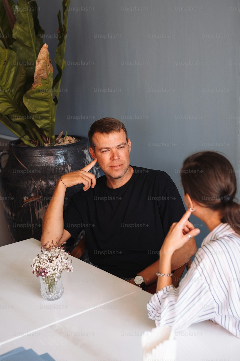 a man and a woman sitting at a table