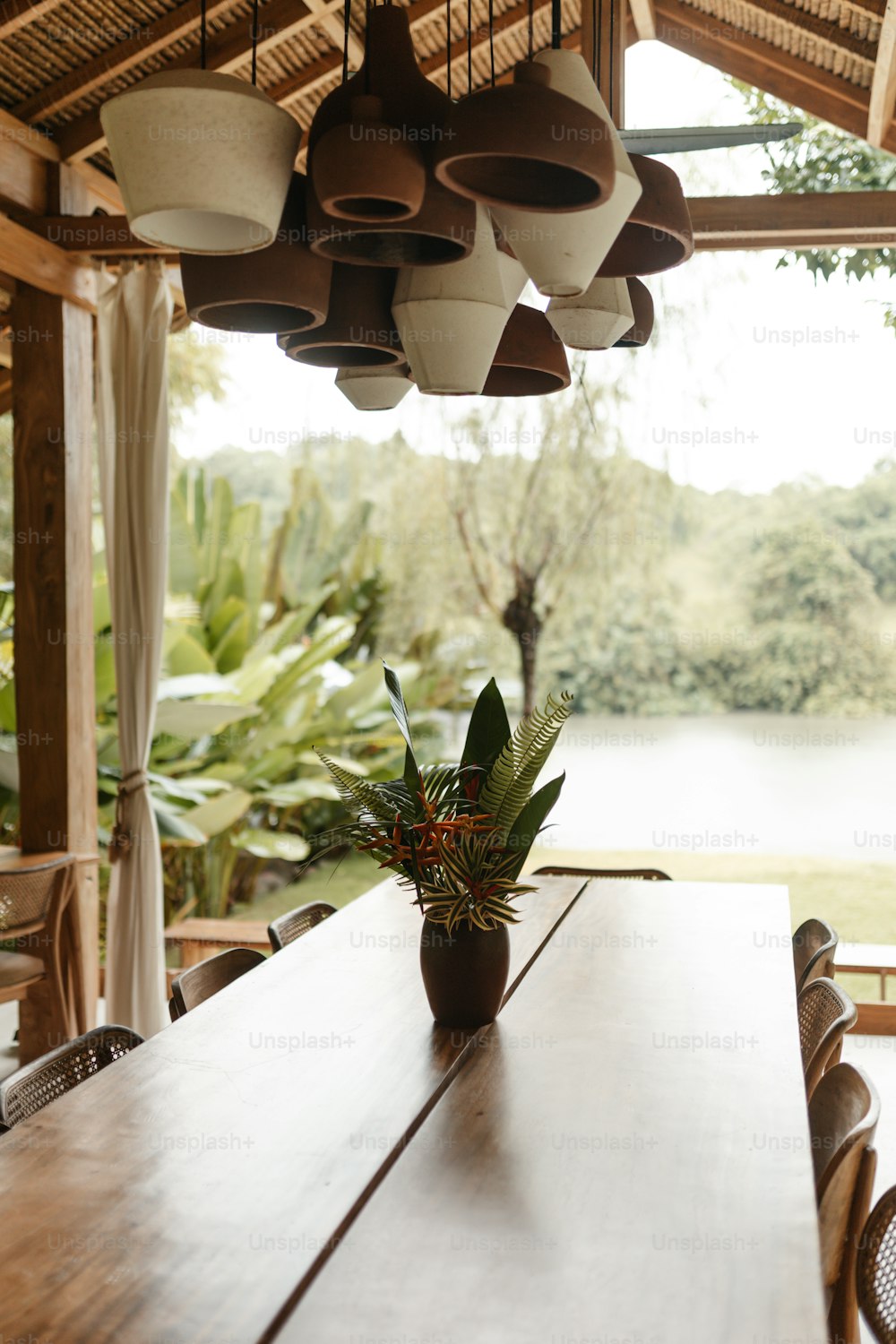 a wooden table with a potted plant on top of it