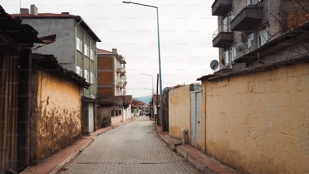 a narrow street with buildings on both sides