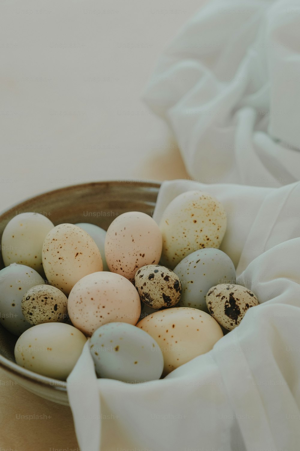 a bowl filled with eggs sitting on top of a table