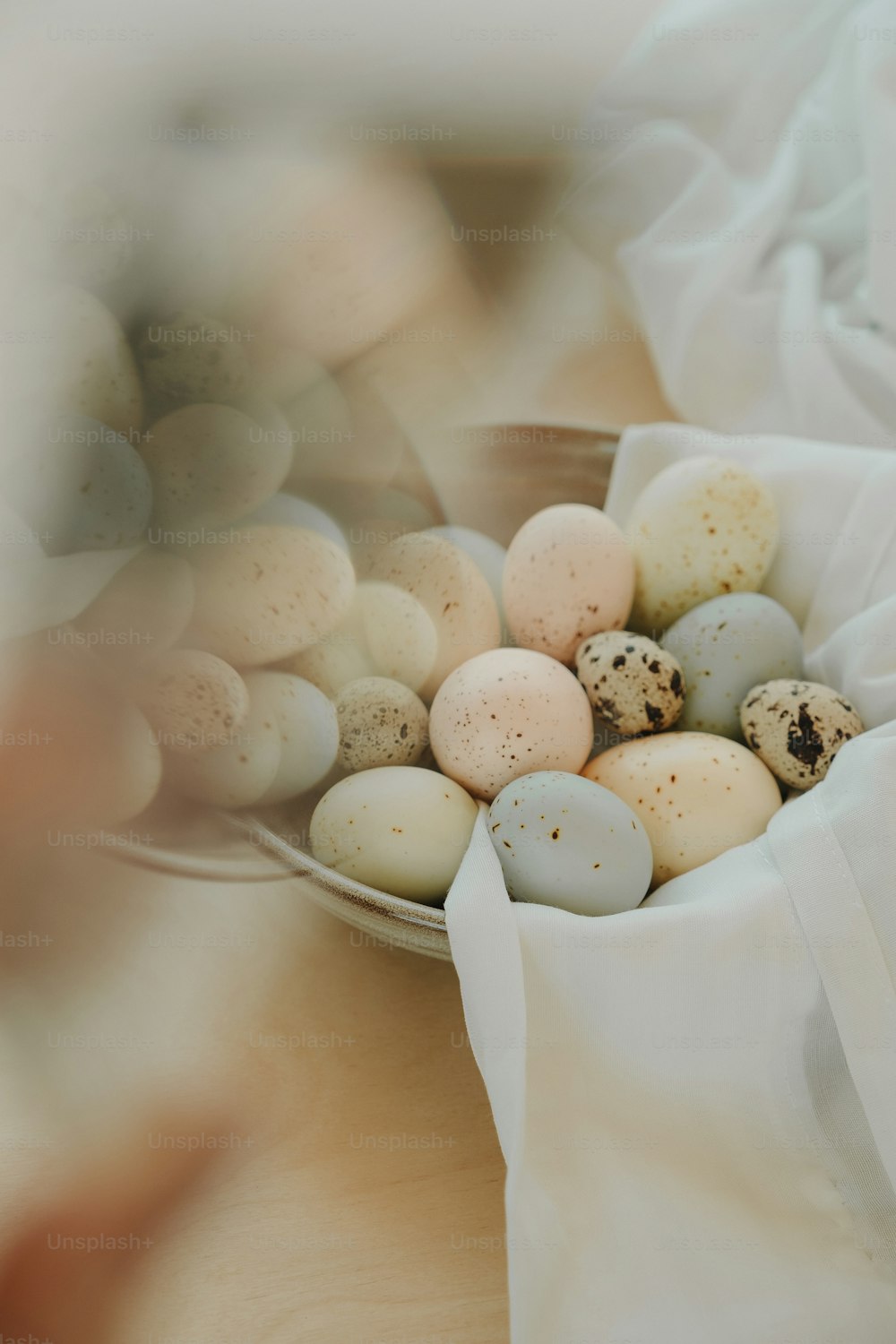 a bowl filled with eggs sitting on top of a table