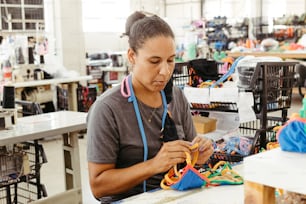 a woman working on a pair of scissors