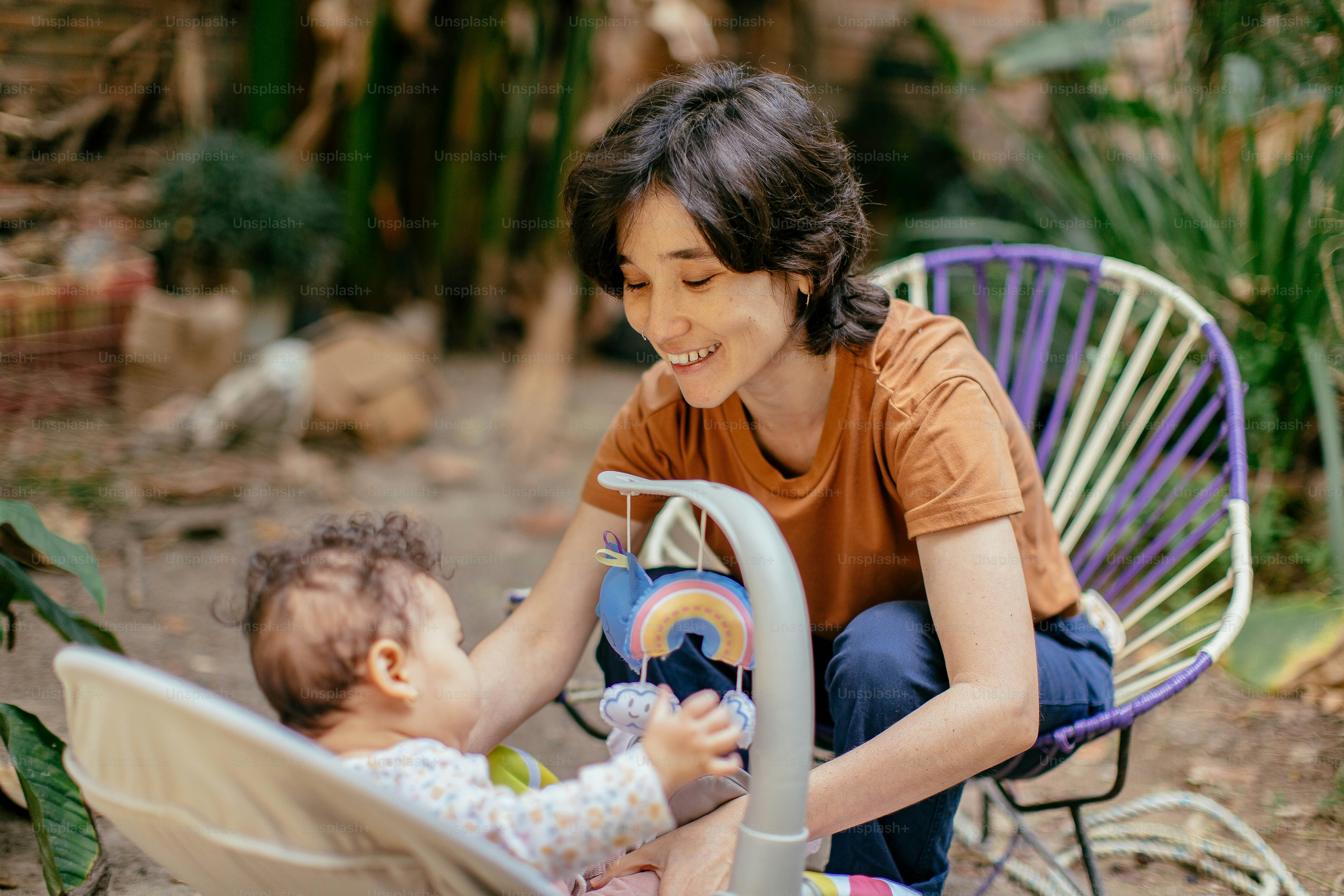 a woman pushing a baby in a stroller