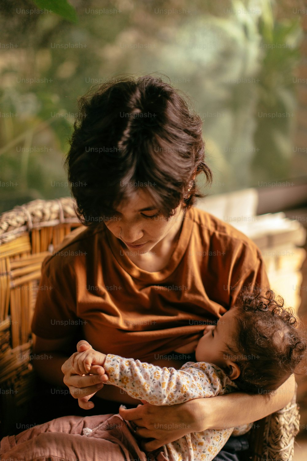 a woman holding a baby in her arms