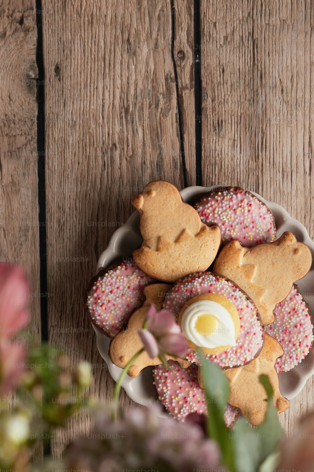 a white plate topped with cookies covered in frosting