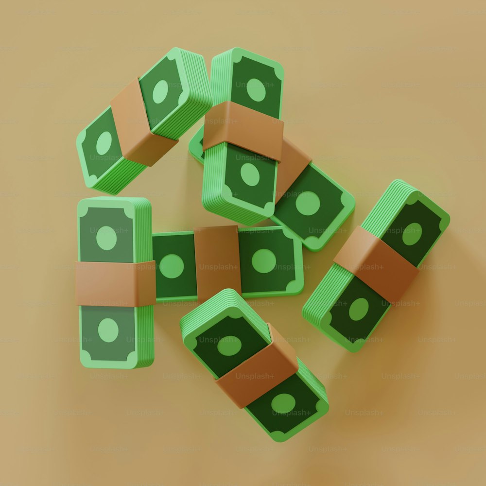 a pile of green and brown dices sitting on top of a table