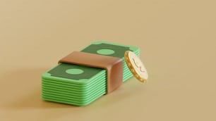 a stack of money with a coin sitting on top of it