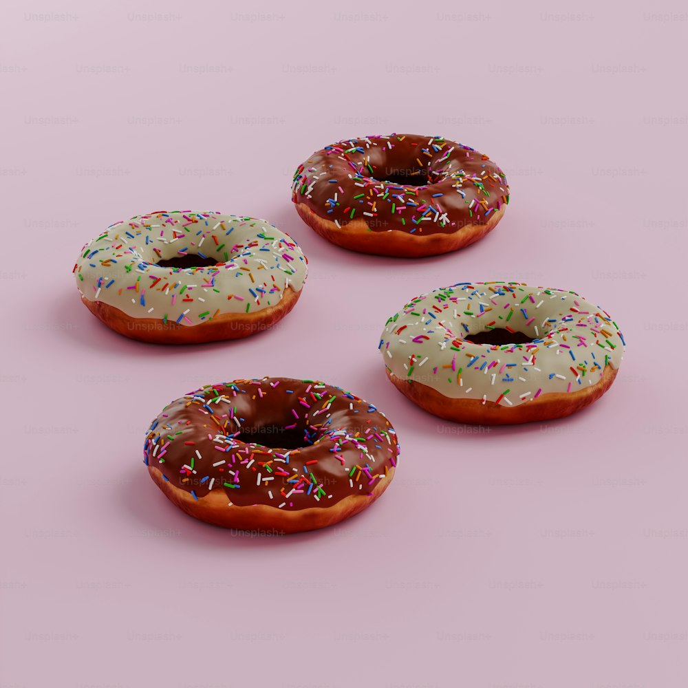 três donuts com cobertura de chocolate e polvilhos