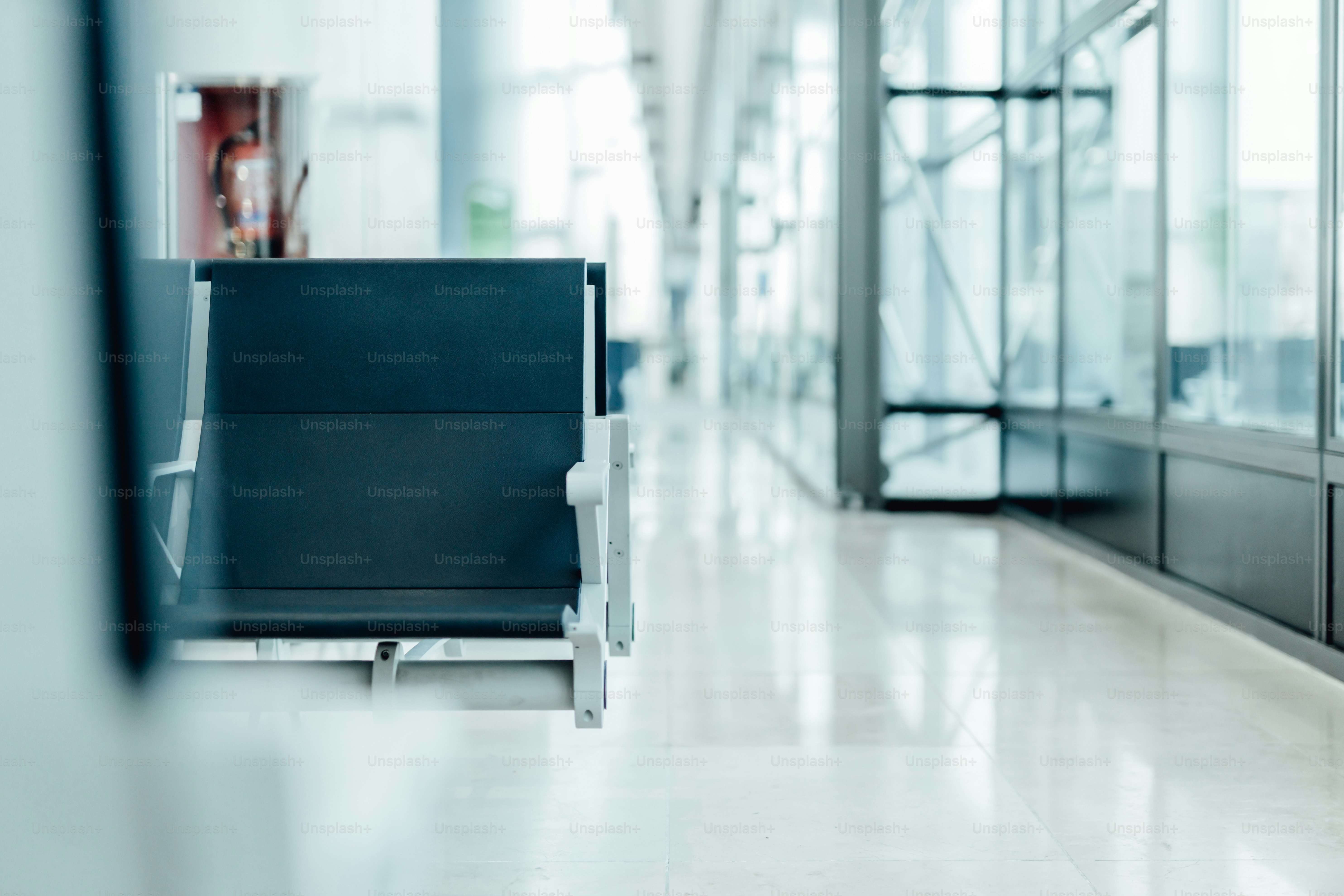 a black chair sitting in a room next to a wall