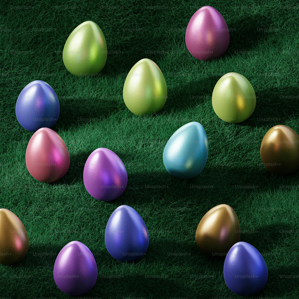 a group of colorful eggs laying on top of a green field