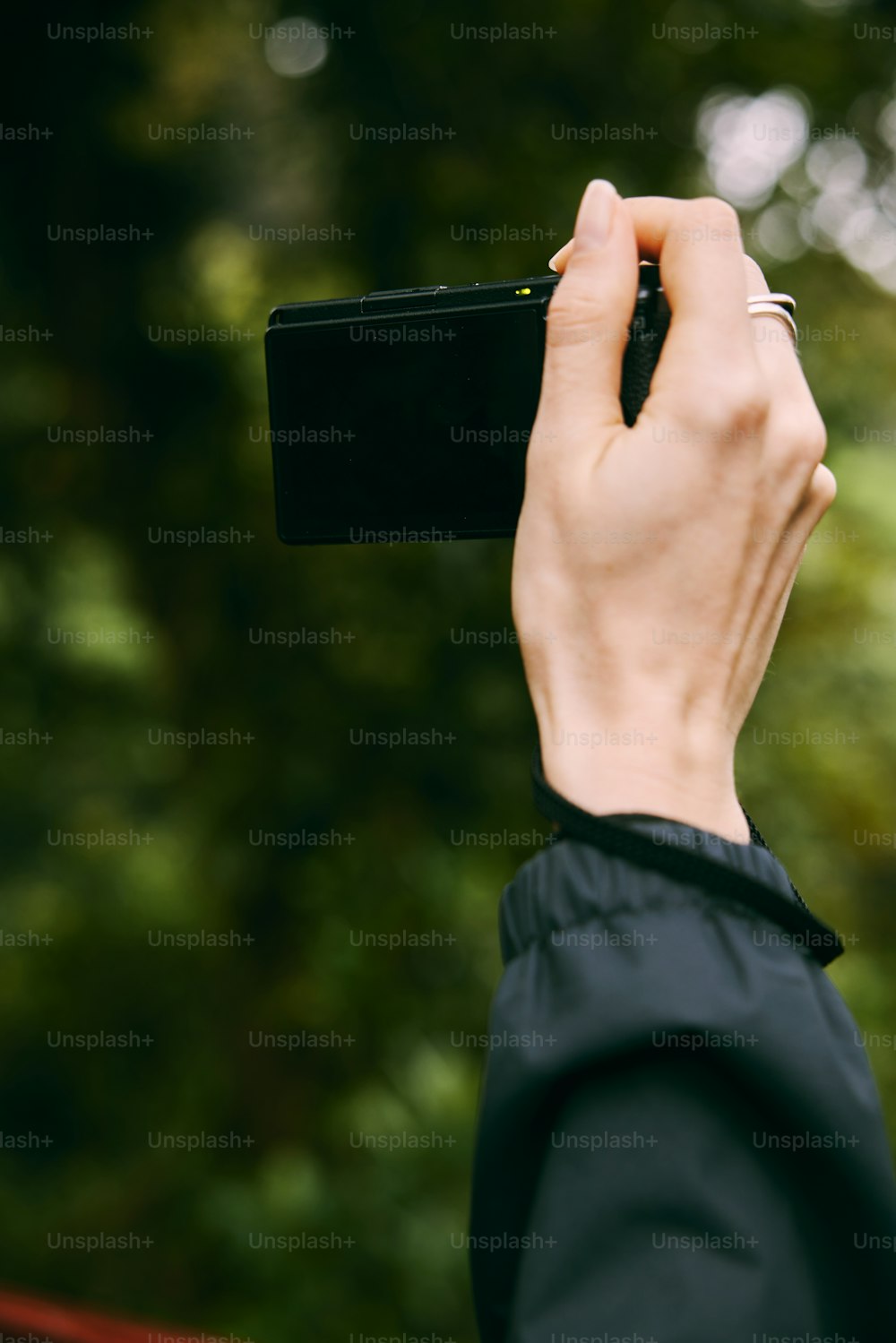 a person taking a picture with a cell phone