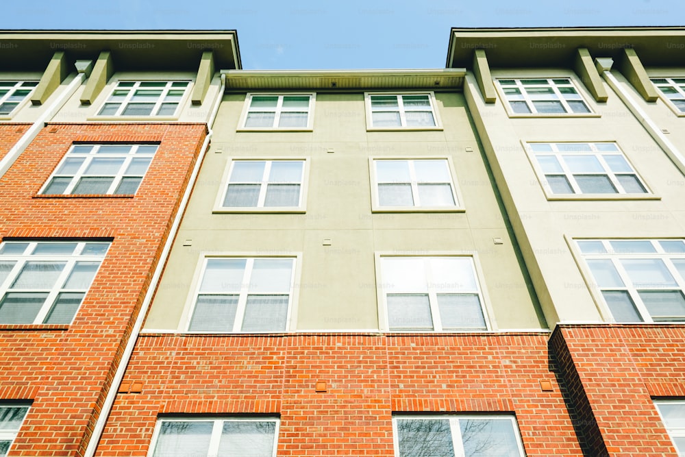 a tall brick building with lots of windows