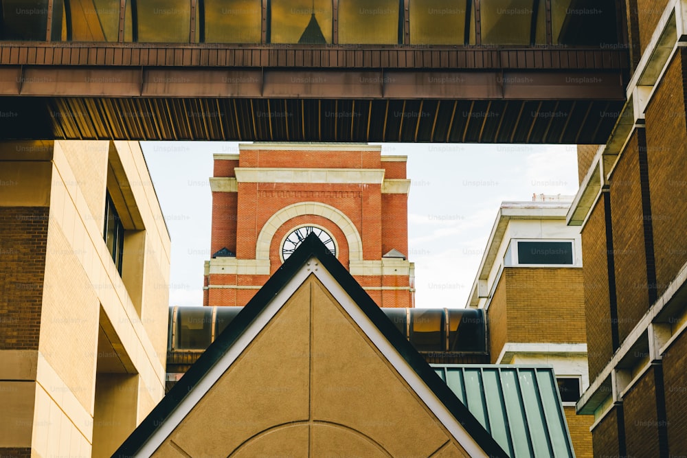 a view of a clock tower from below