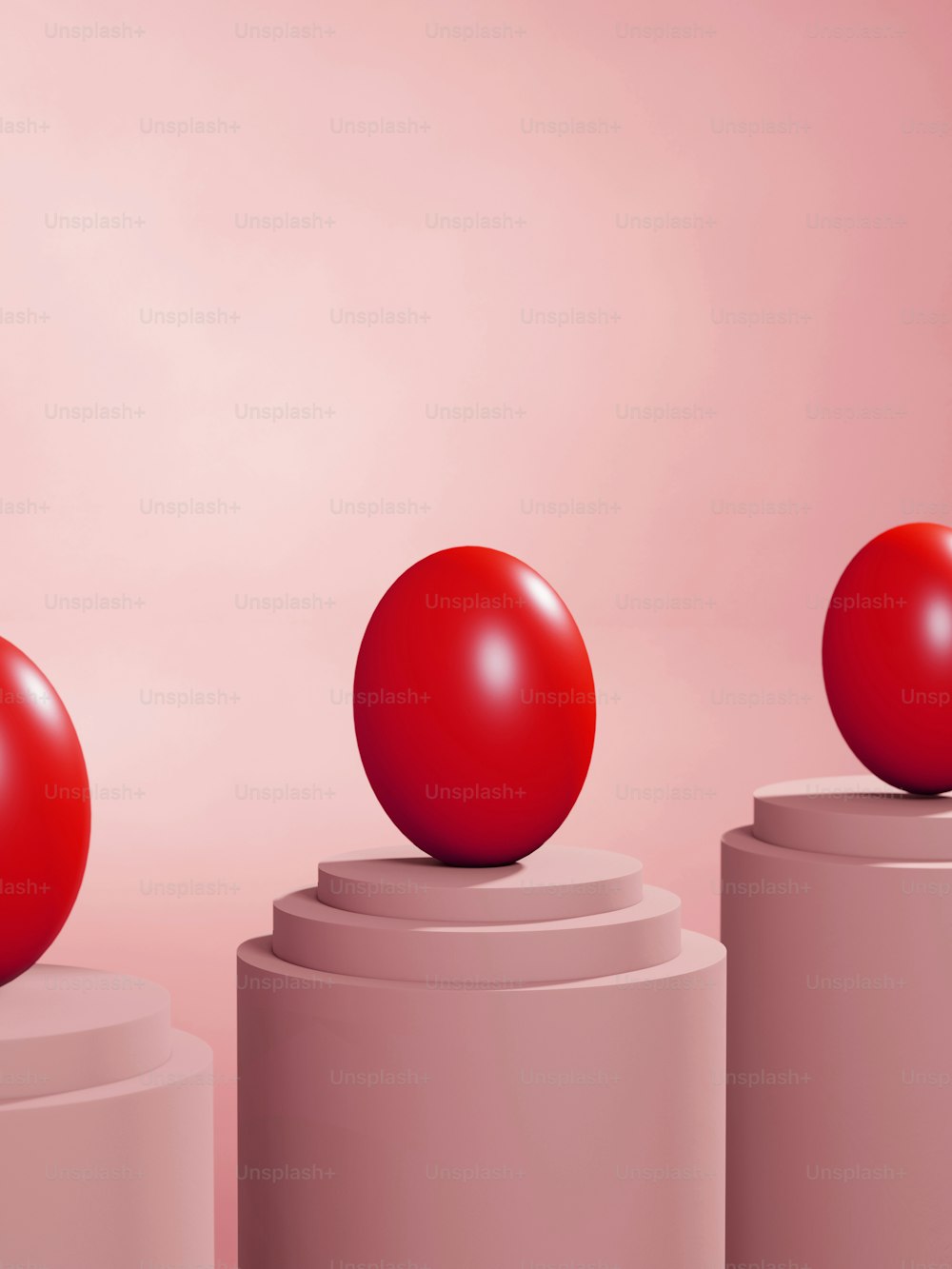 a red ball sitting on top of a white pedestal