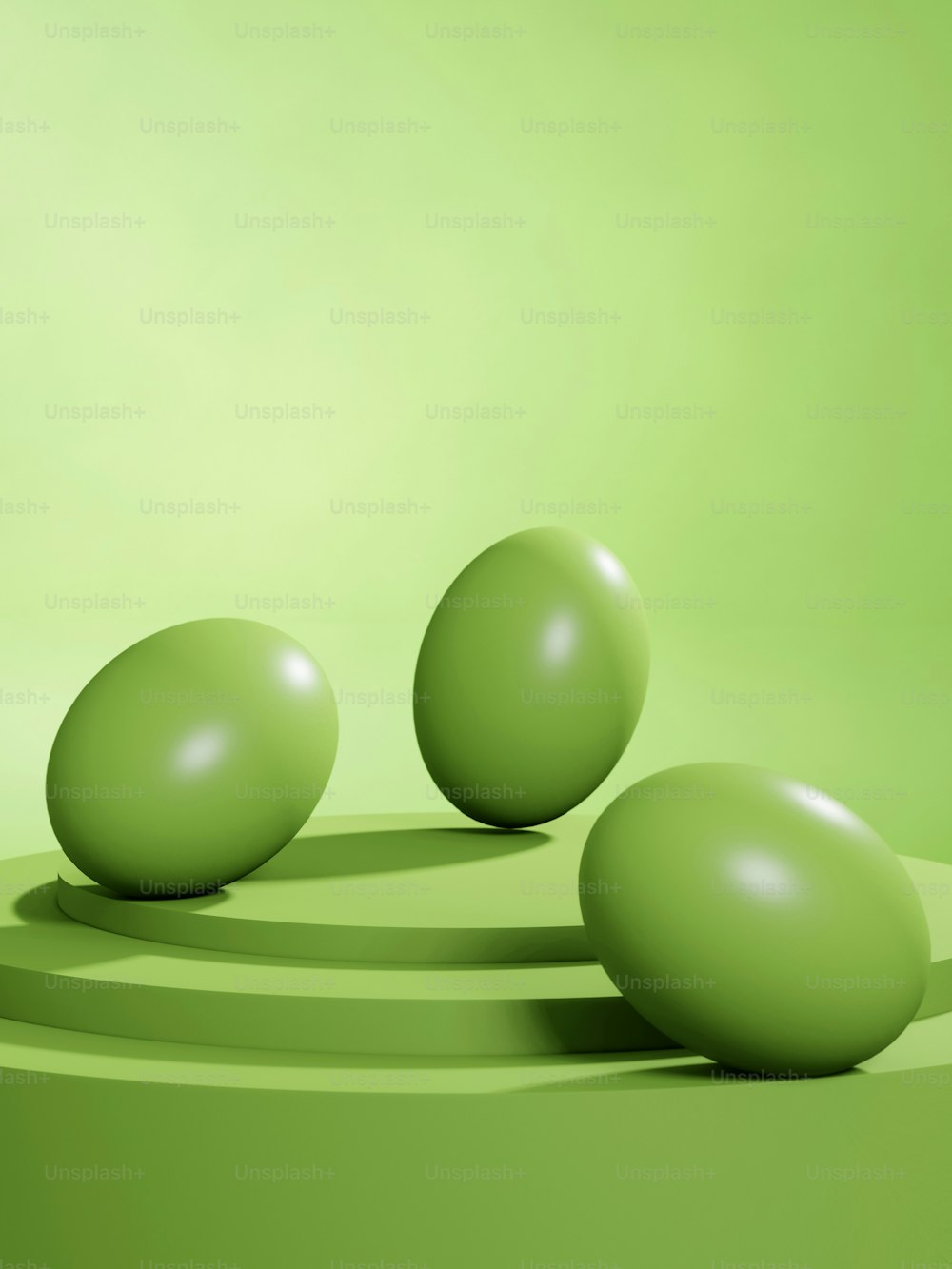 three green balls on a green surface