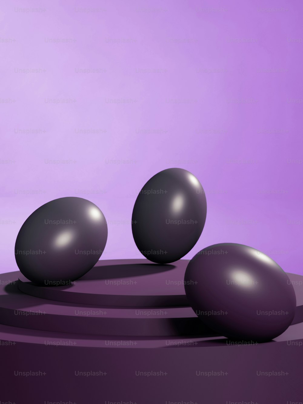 a group of three balls sitting on top of a table