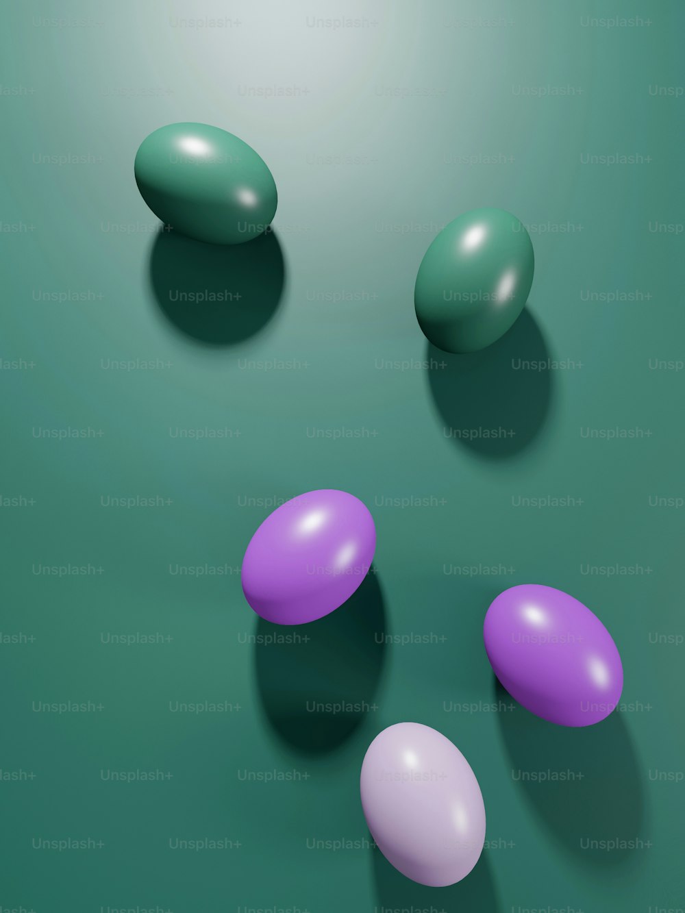 a group of three eggs sitting on top of a green surface