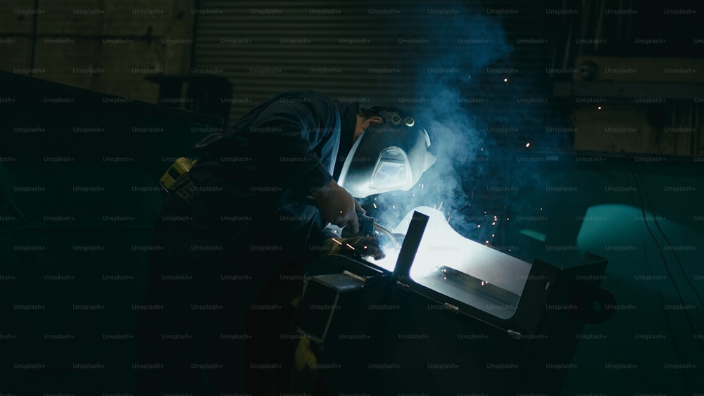 a welder working on a piece of metal