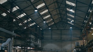 a large warehouse with a lot of lights on the ceiling