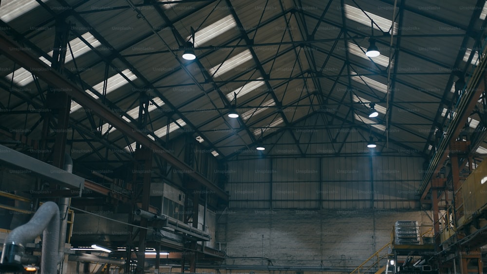 a large warehouse with a lot of lights on the ceiling