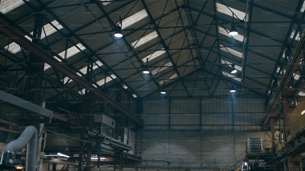 a large warehouse with a lot of lights on the ceiling
