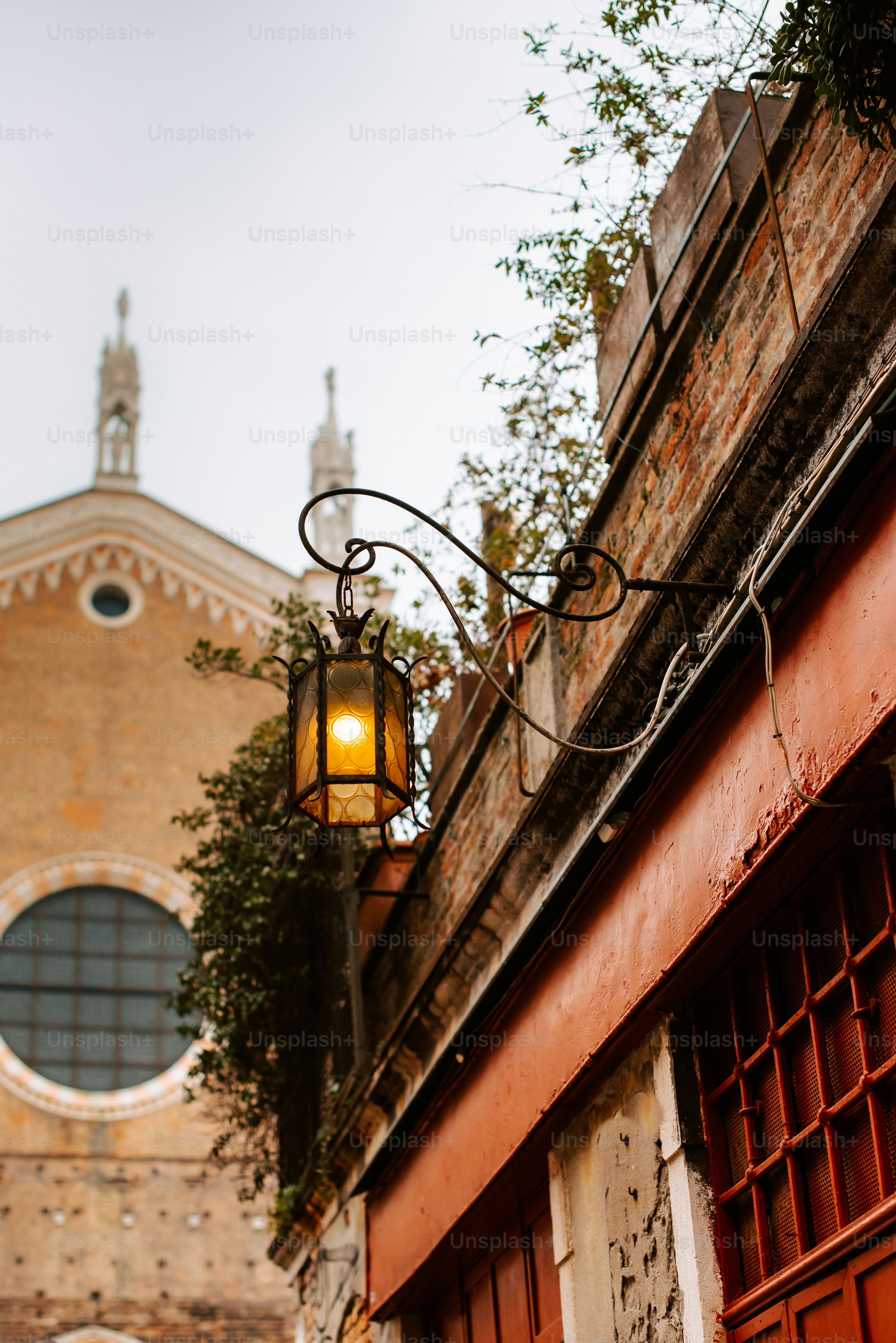 a street light hanging from the side of a building