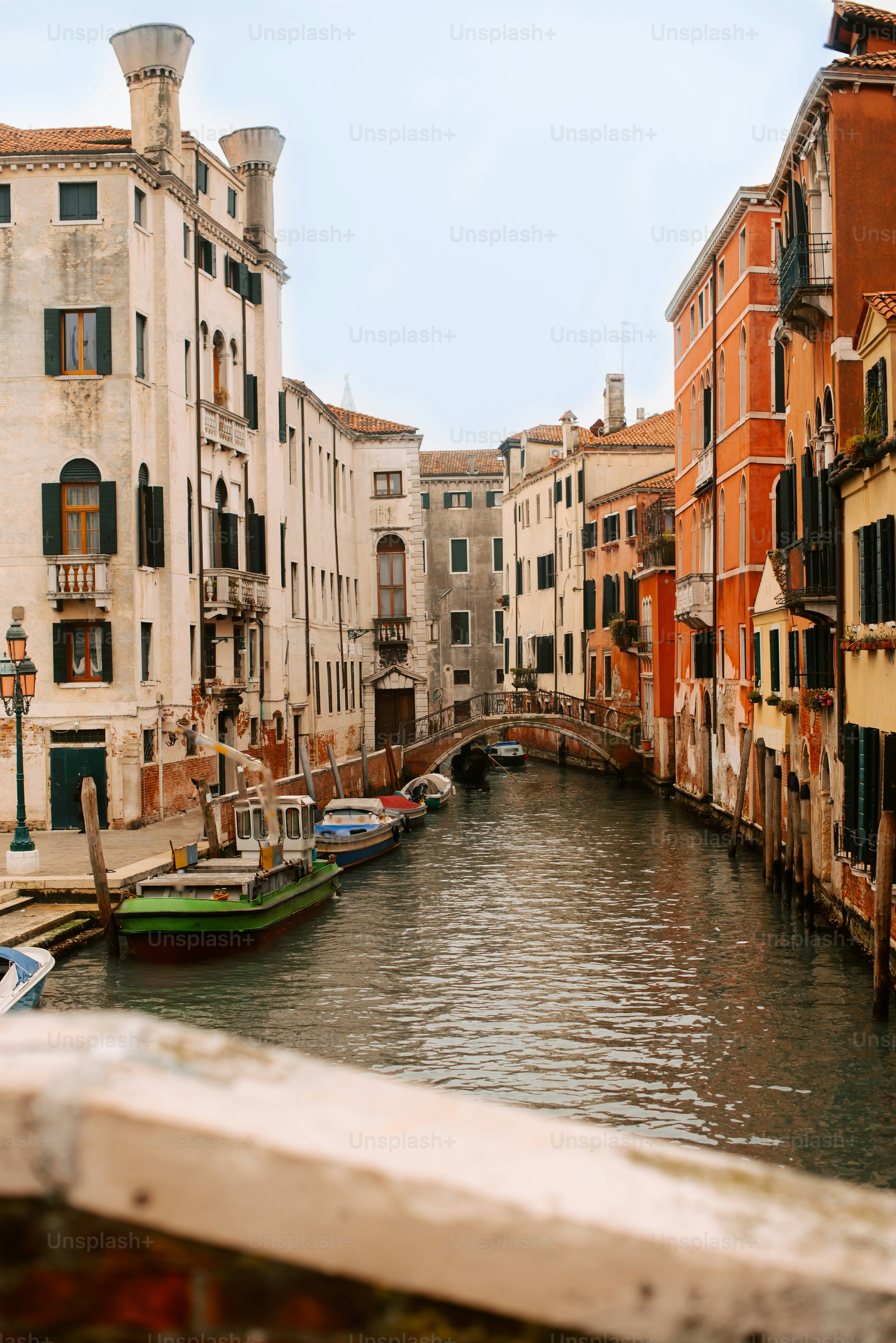 a canal with several small boats in it