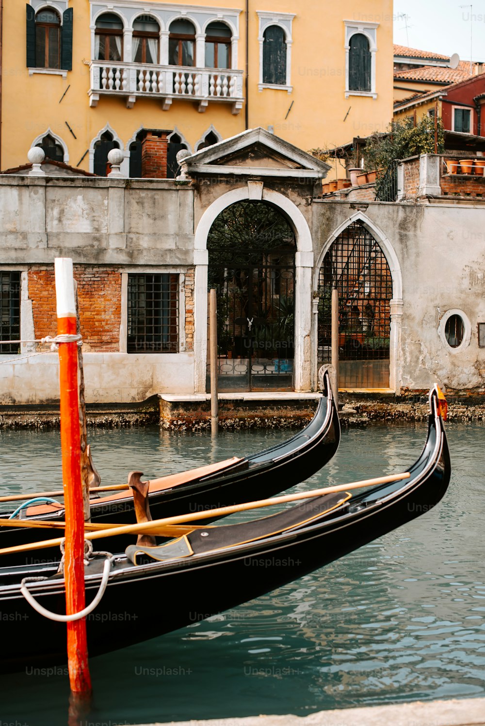 a couple of gondolas that are sitting in the water