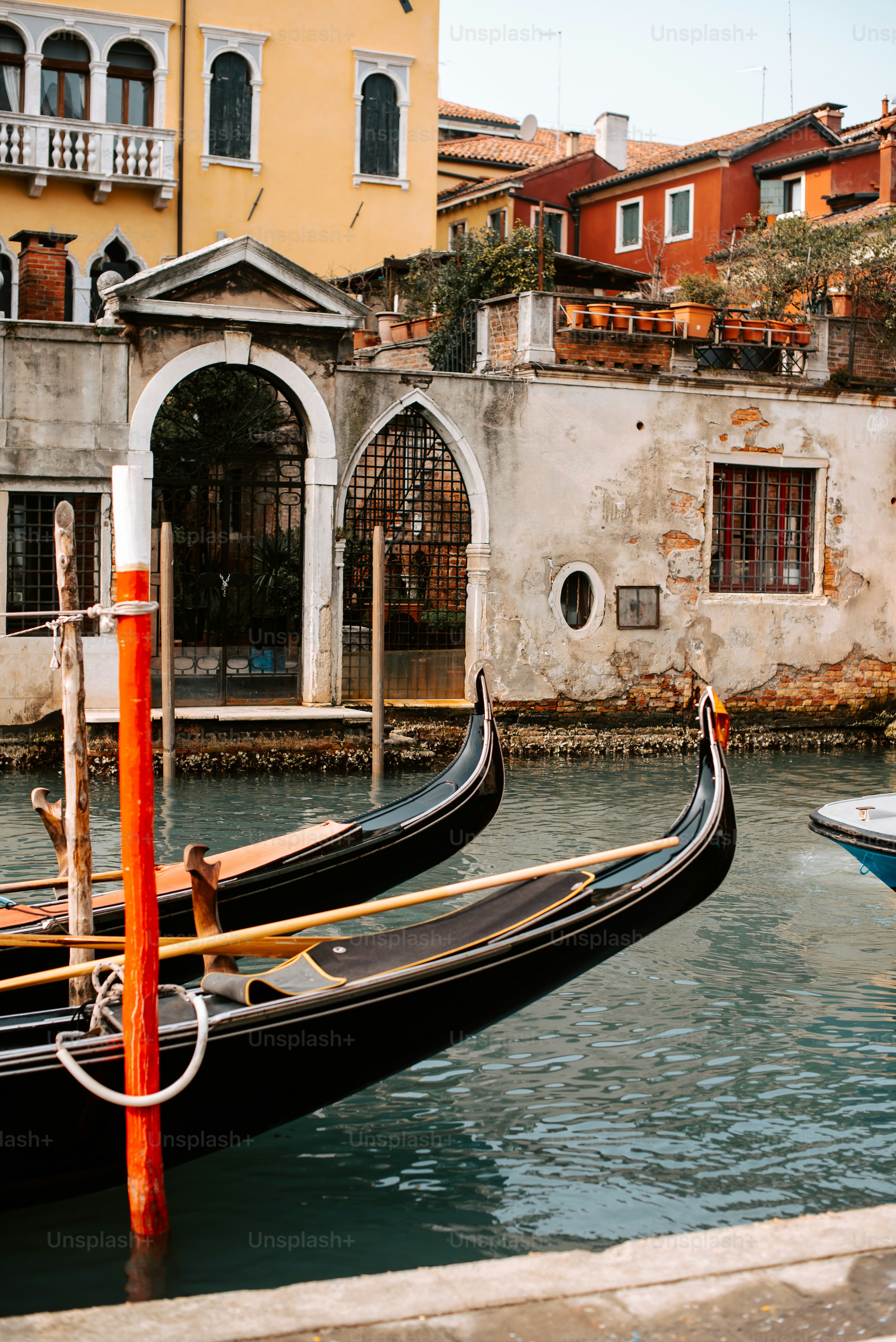 a couple of gondolas that are sitting in the water