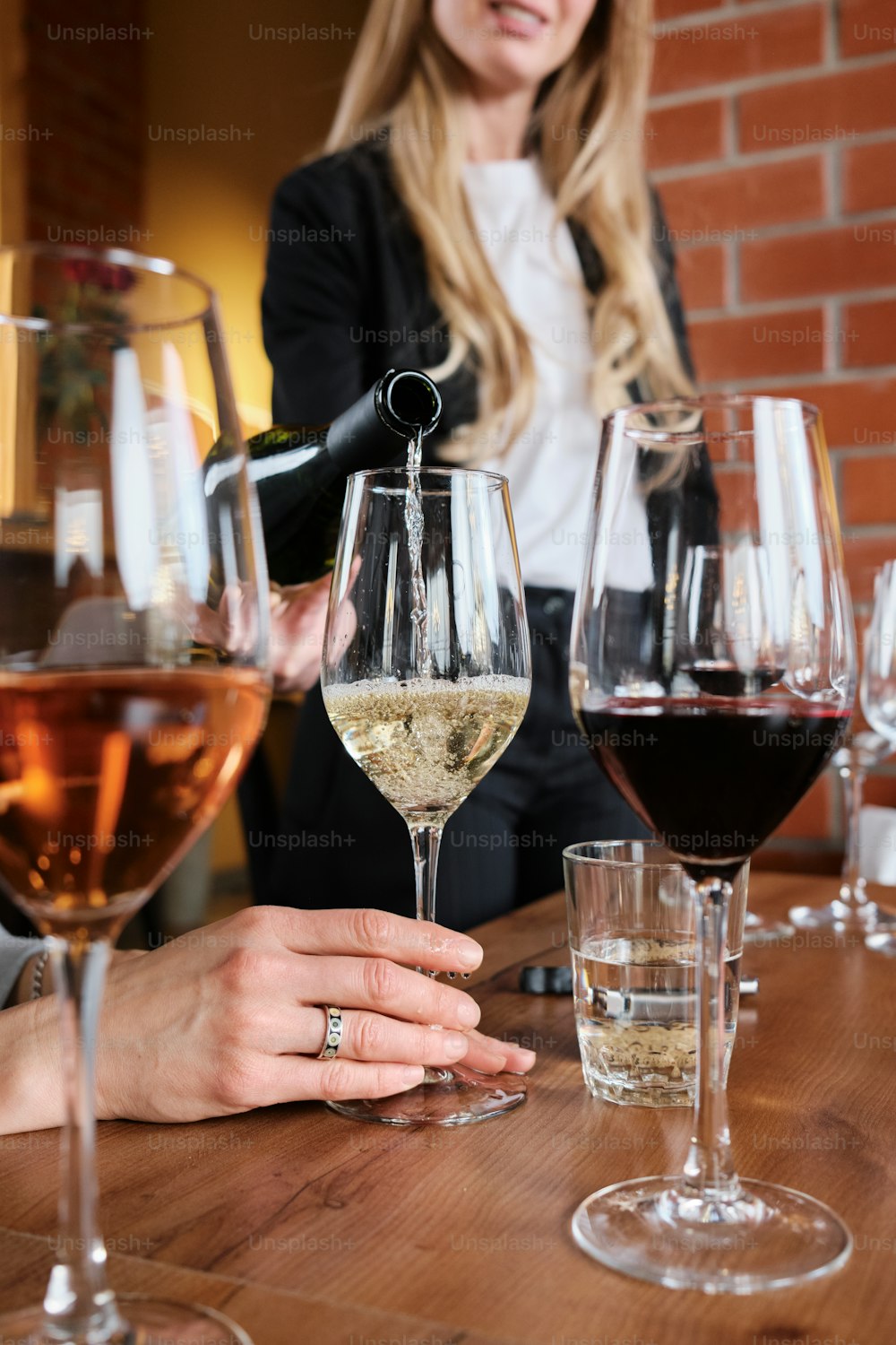 a group of people sitting at a table with wine glasses