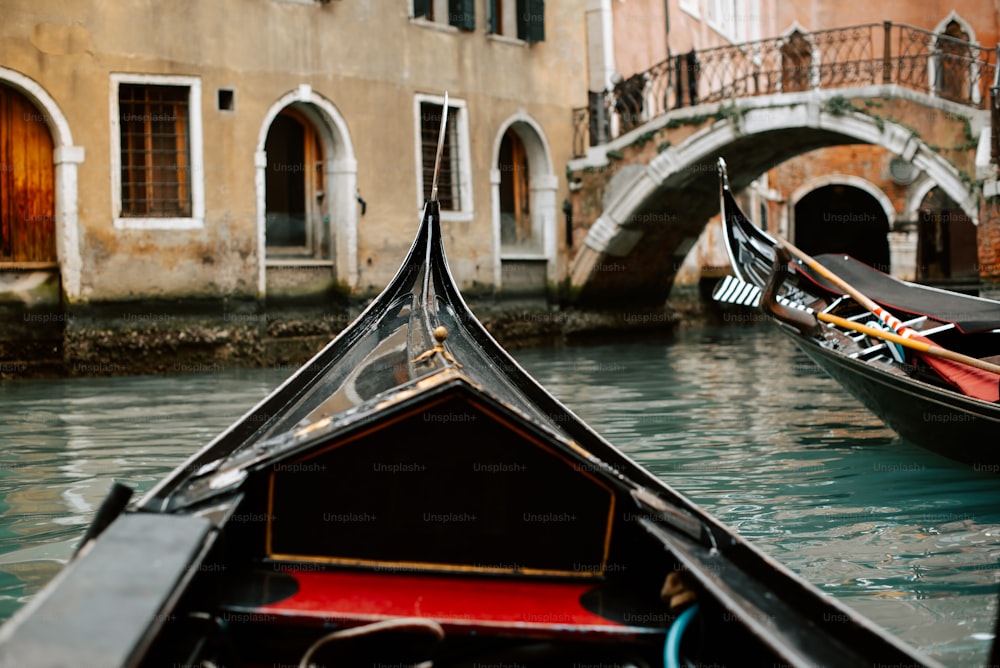 a couple of gondolas that are sitting in the water