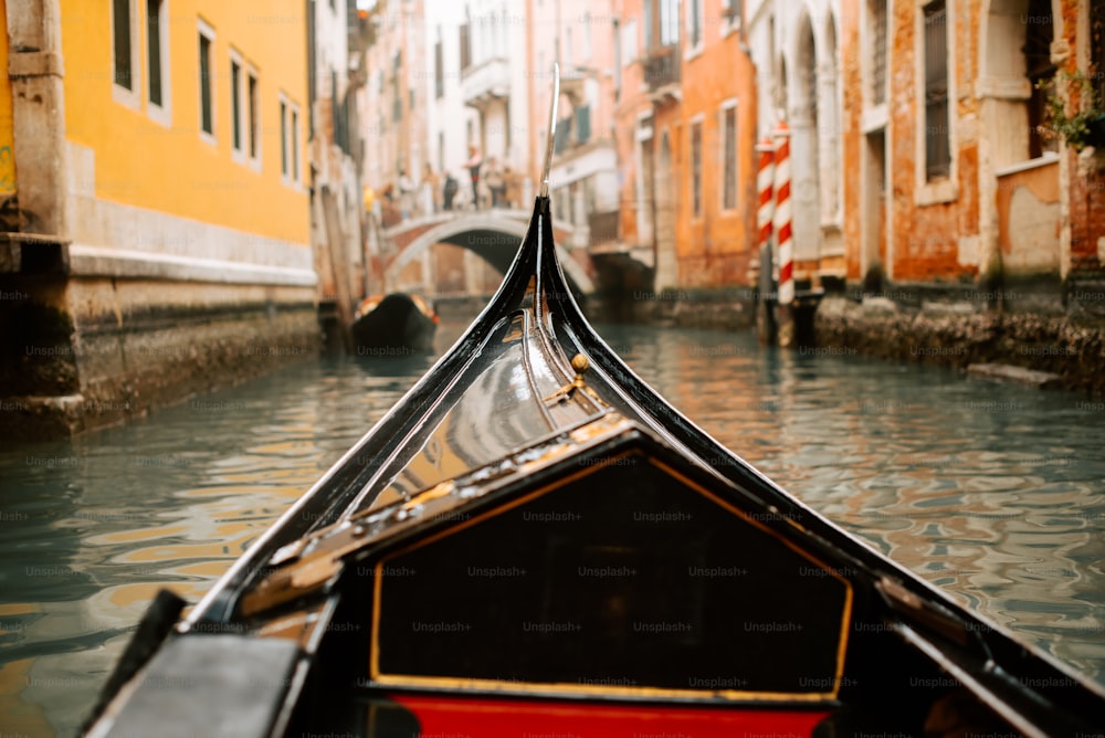 a boat is going down a canal in a city