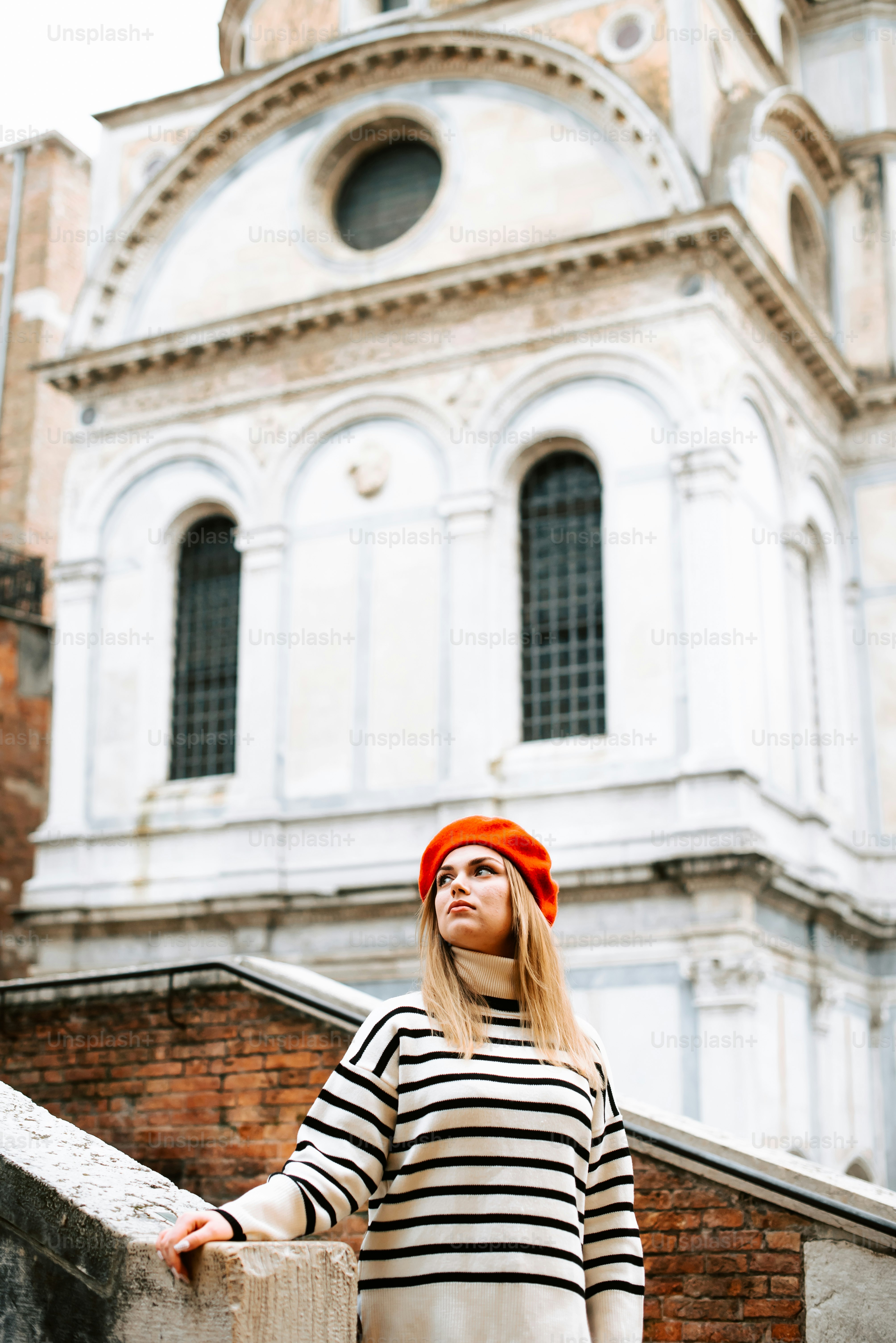 A woman in a striped shirt and orange hat photo – Fashion Image on Unsplash