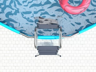 an overhead view of a swimming pool with a chair