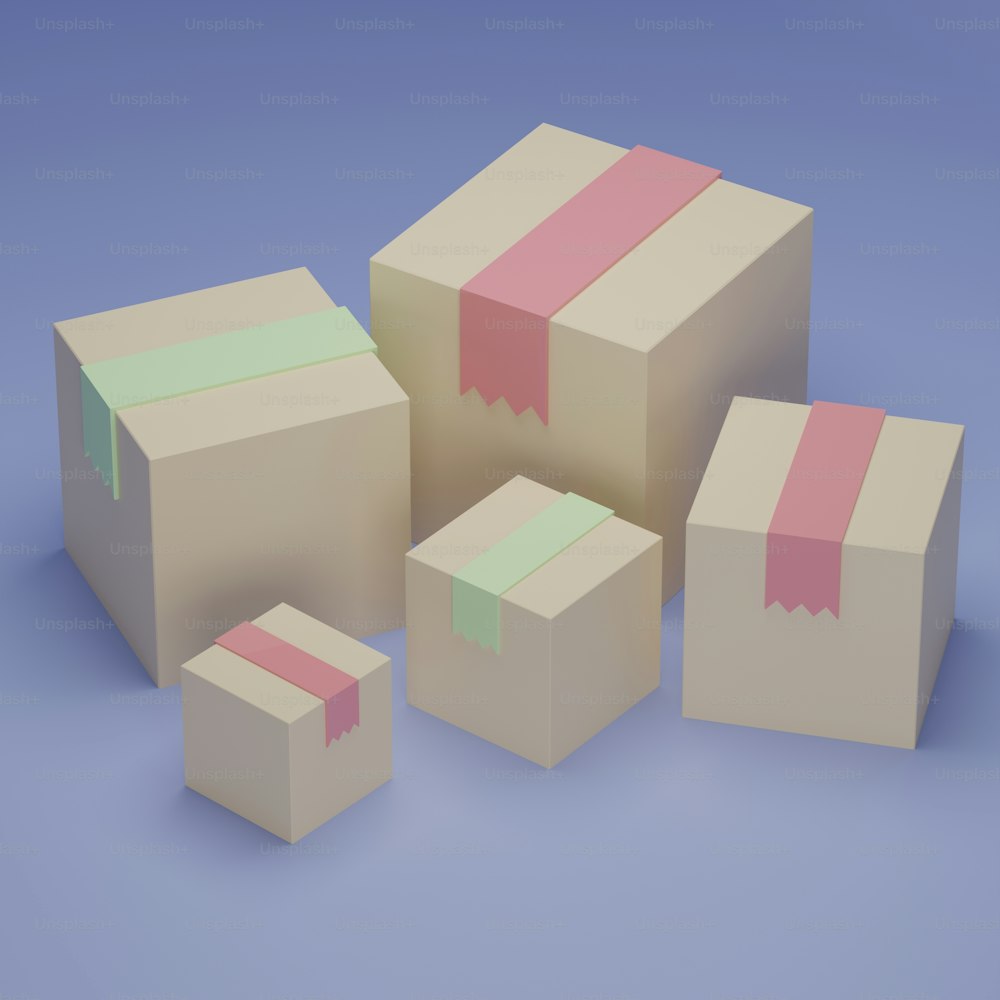 a group of three boxes with pink and green ribbons